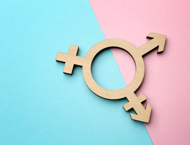 The transgender symbol on a colored background.