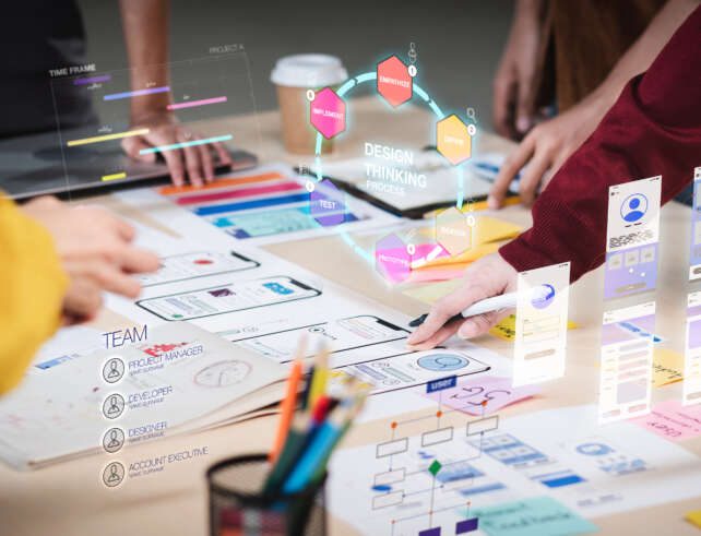 Close up ux developer and ui designer use augmented reality brainstorming about mobile app interface wireframe design on desk at modern office.Creative digital development agency